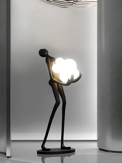 Strong MAN holds balls floor lamp