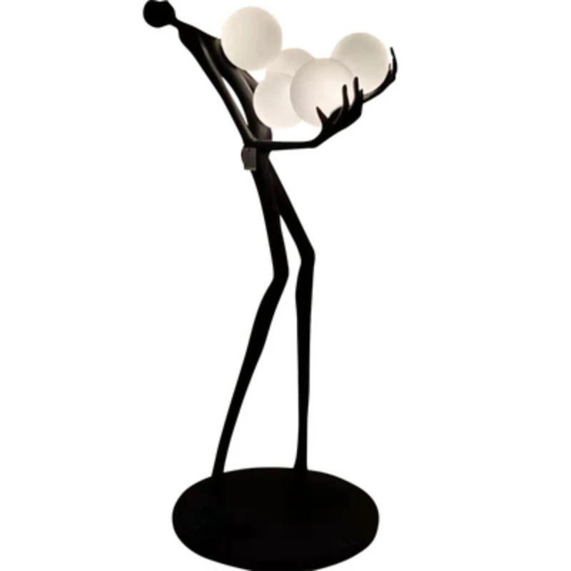 Strong MAN holds balls floor lamp