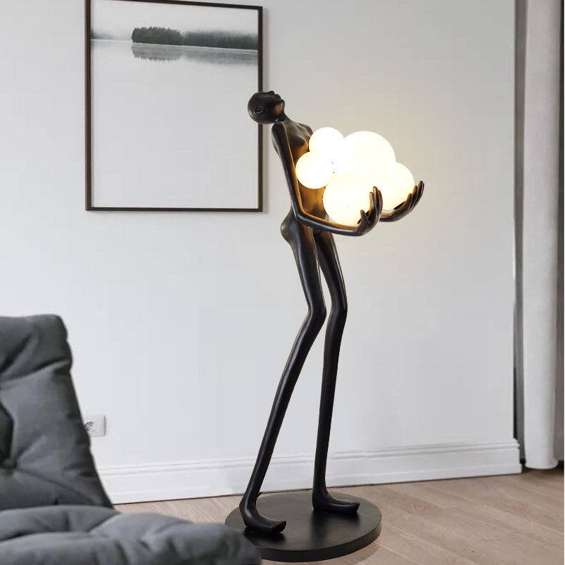 Strong MAN holds balls floor lamp