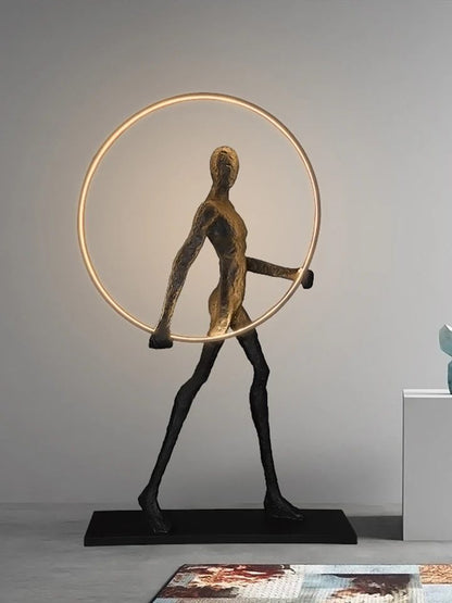 Man with a ring floor lamp