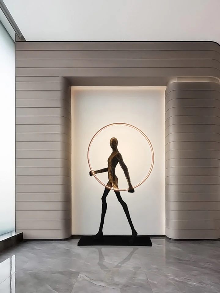 Man with a ring floor lamp