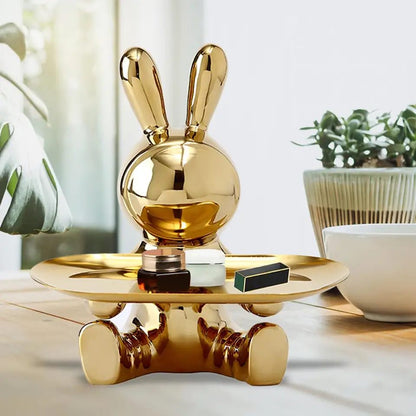 Golden rabbit holding things